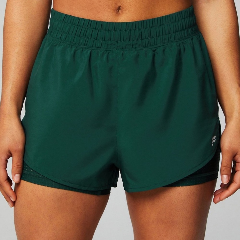 Fabletics Perforated Run Shorts 2” in Deep Sea Green